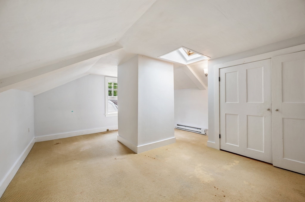 651 Main Street Hingham, MA 02043 - Photo 31 of 42 an empty room with an entryway and closet area