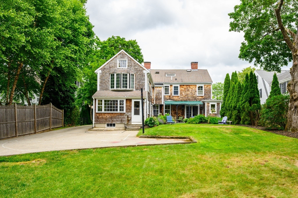 651 Main Street Hingham, MA 02043 - Photo 36 of 42 a front view of a house with a yard