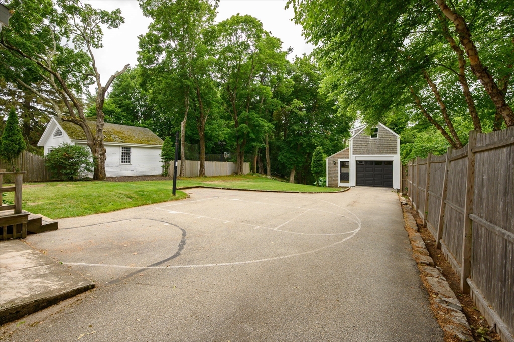651 Main Street Hingham, MA 02043 - Photo 37 of 42 a house with tree in front of it