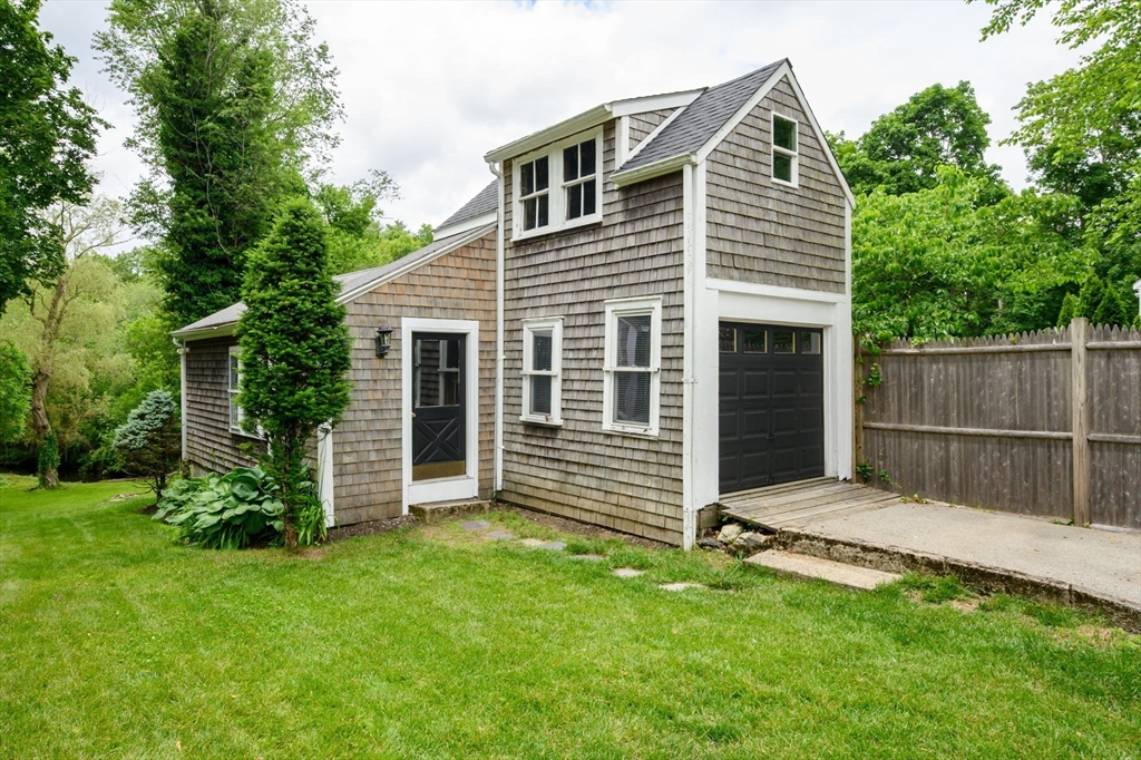 651 Main Street Hingham, MA 02043 - Photo 38 of 42 a view of a house with a backyard