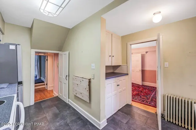 a view of kitchen with wooden floor