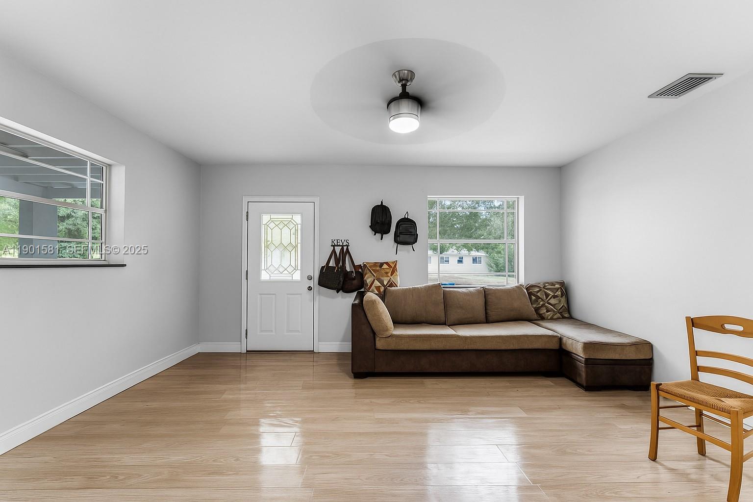 538 Northwest 11th Street Homestead, FL 33030 - Photo 3 of 14 a living room with furniture and a large window