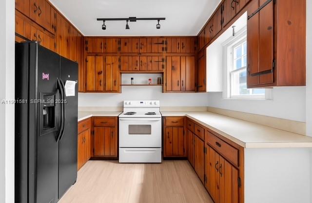538 Northwest 11th Street Homestead, FL 33030 - Photo 5 of 14 a kitchen with stainless steel appliances a refrigerator and a stove