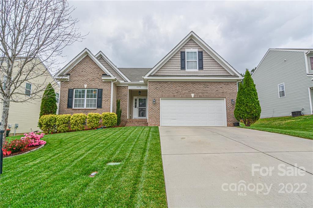 1672 Beleek Ridge Lane Clover, SC 29710 - Photo 1 of 32 a front view of a house with a yard and garage