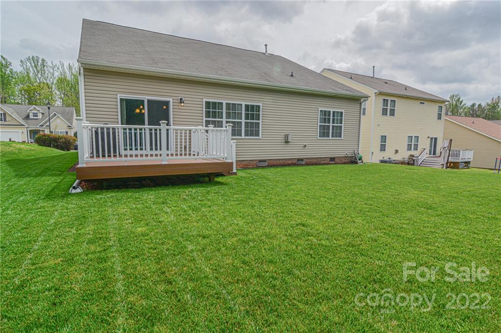 1672 Beleek Ridge Lane Clover, SC 29710 - Photo 23 of 32 a view of a house with a backyard and deck