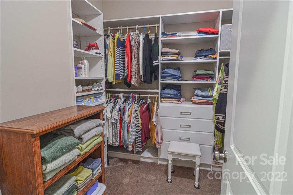 1672 Beleek Ridge Lane Clover, SC 29710 - Photo 26 of 32 a view of walk in closet with clothes and shoes