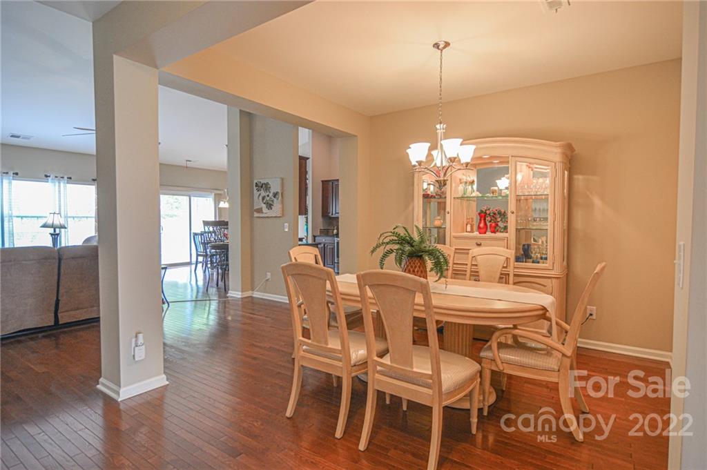 1672 Beleek Ridge Lane Clover, SC 29710 - Photo 3 of 32 a view of a dining room with furniture and wooden floor