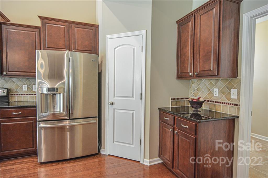 1672 Beleek Ridge Lane Clover, SC 29710 - Photo 8 of 32 a kitchen with stainless steel appliances granite countertop a refrigerator and a sink