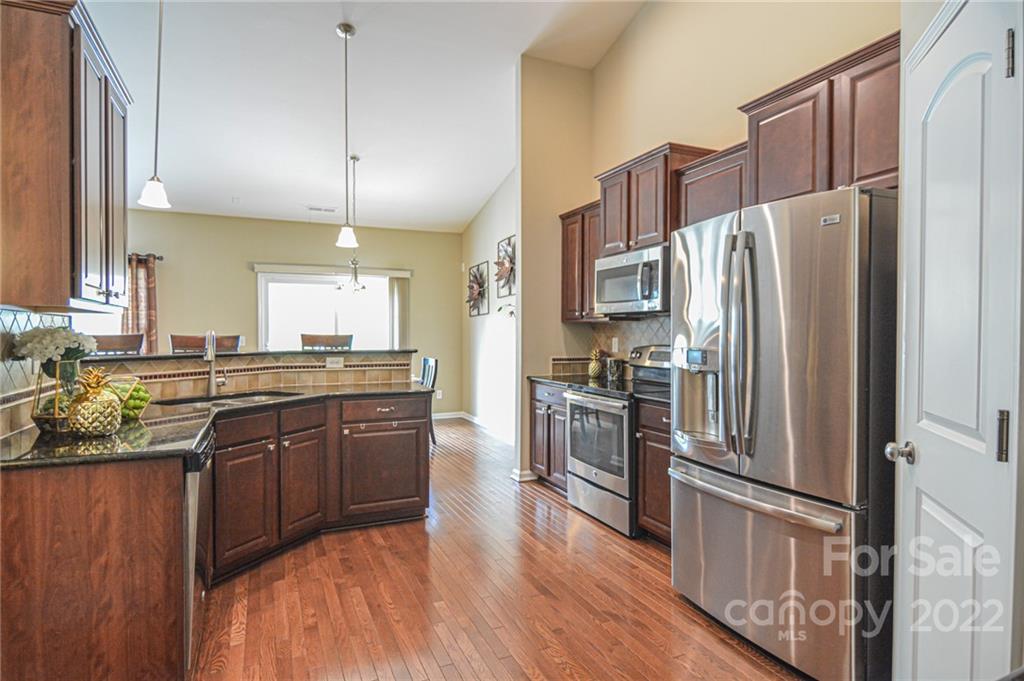1672 Beleek Ridge Lane Clover, SC 29710 - Photo 9 of 32 a kitchen with stainless steel appliances granite countertop a refrigerator a stove top oven a sink and dishwasher
