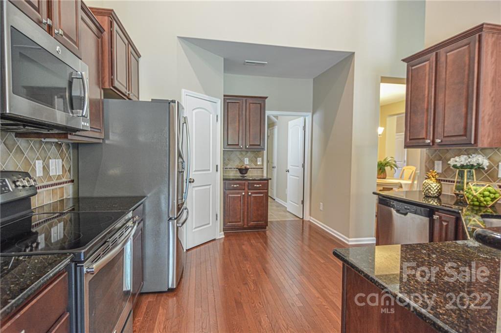 1672 Beleek Ridge Lane Clover, SC 29710 - Photo 10 of 32 a kitchen with stainless steel appliances granite countertop a refrigerator microwave and stove