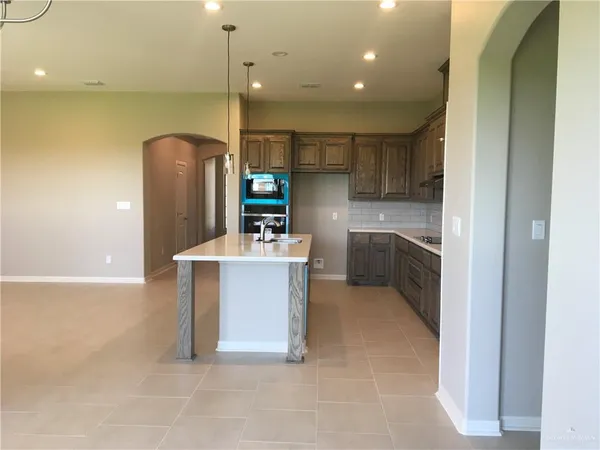 a kitchen with cabinets and sink