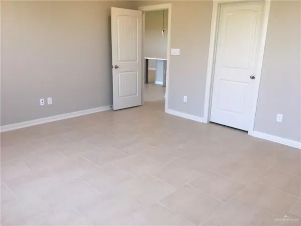 a view of an empty room and closet