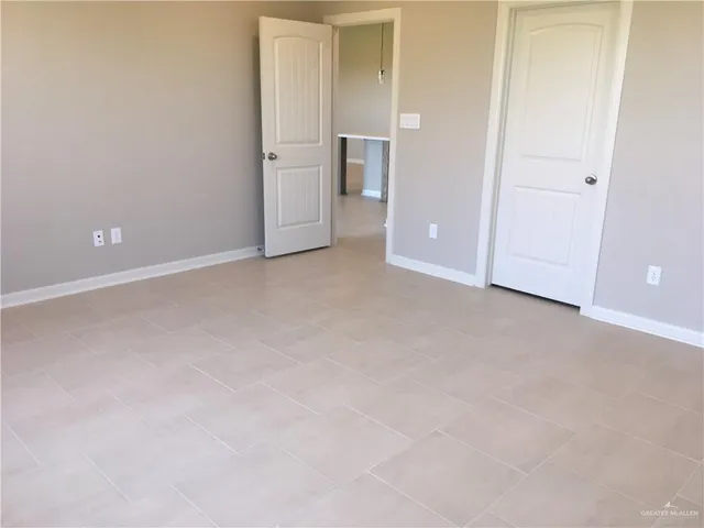 a view of an empty room and closet
