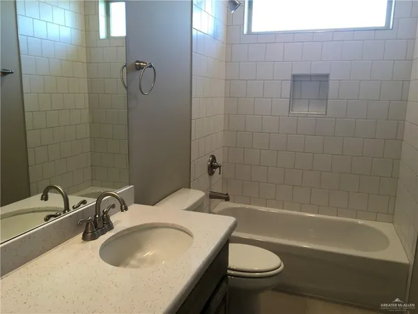 a bathroom with a sink a toilet and a bathtub