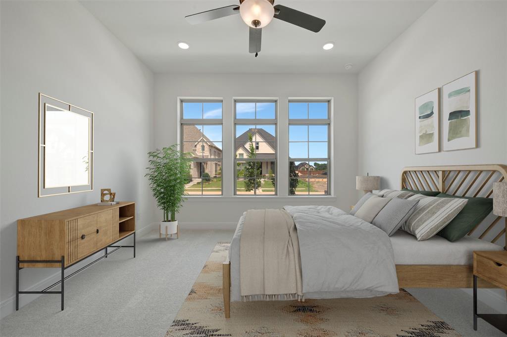 1908 Cola Drive Van Alstyne, TX 75495 - Photo 6 of 29 Spacious room featuring three large windows, a ceiling fan with integrated lighting, recessed lighting, and light-toned carpeting