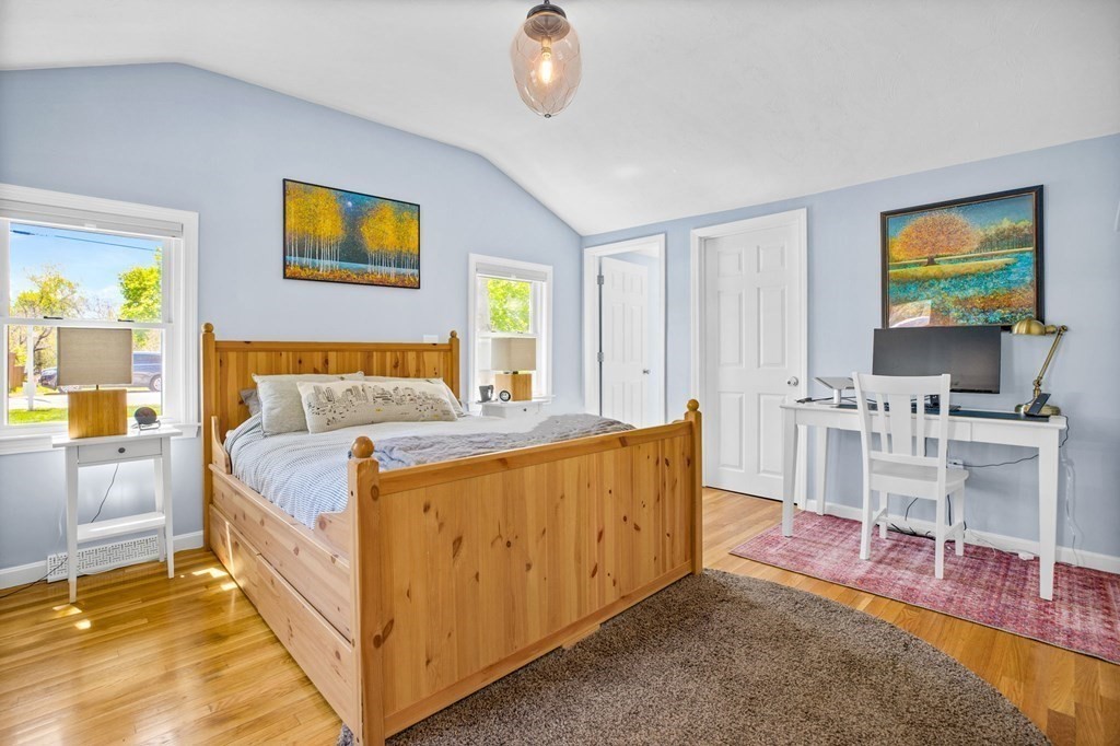 176 Stockbridge Road Scituate, MA 02066 - Photo 11 of 27 a bedroom with a bed and a flat screen tv