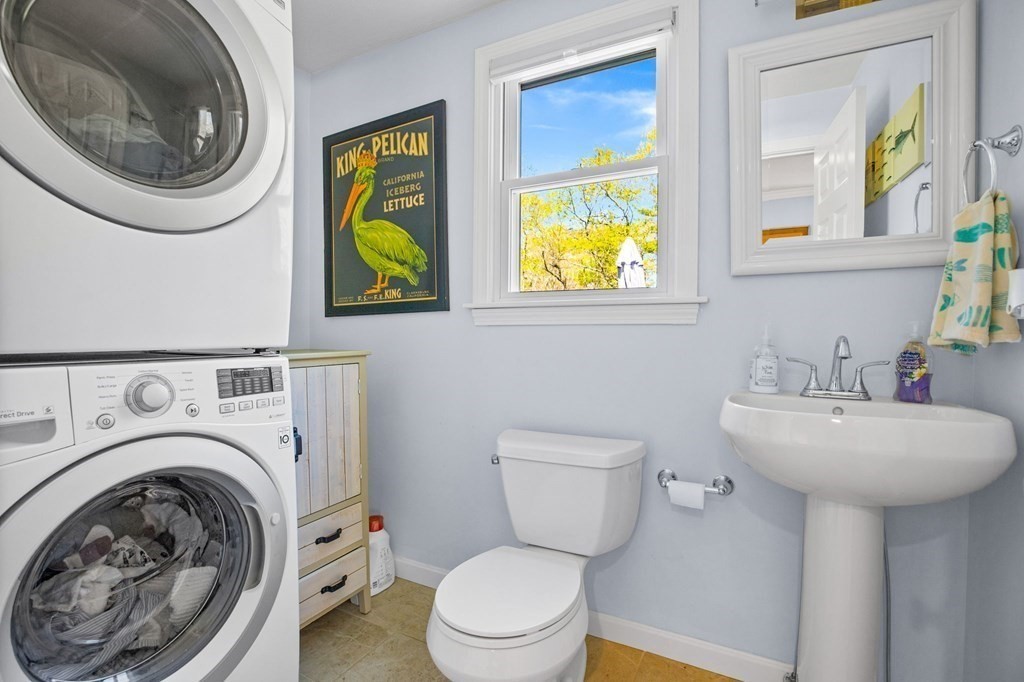 176 Stockbridge Road Scituate, MA 02066 - Photo 10 of 27 a bathroom with a sink a mirror and toilet