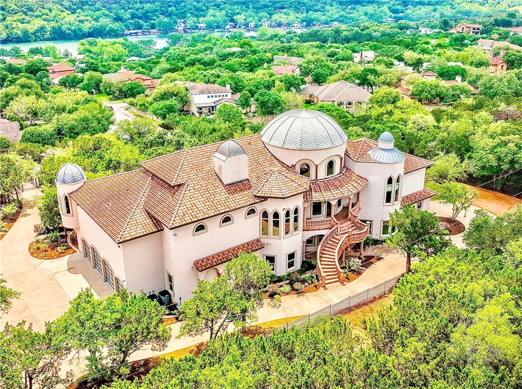 an aerial view of a house with yard swimming pool and outdoor seating