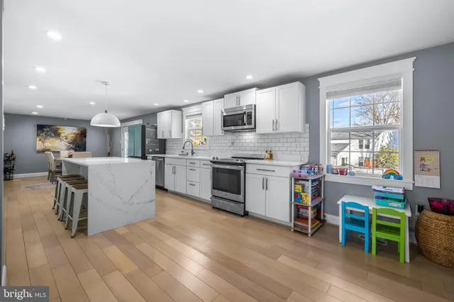a kitchen with furniture and a counter top space