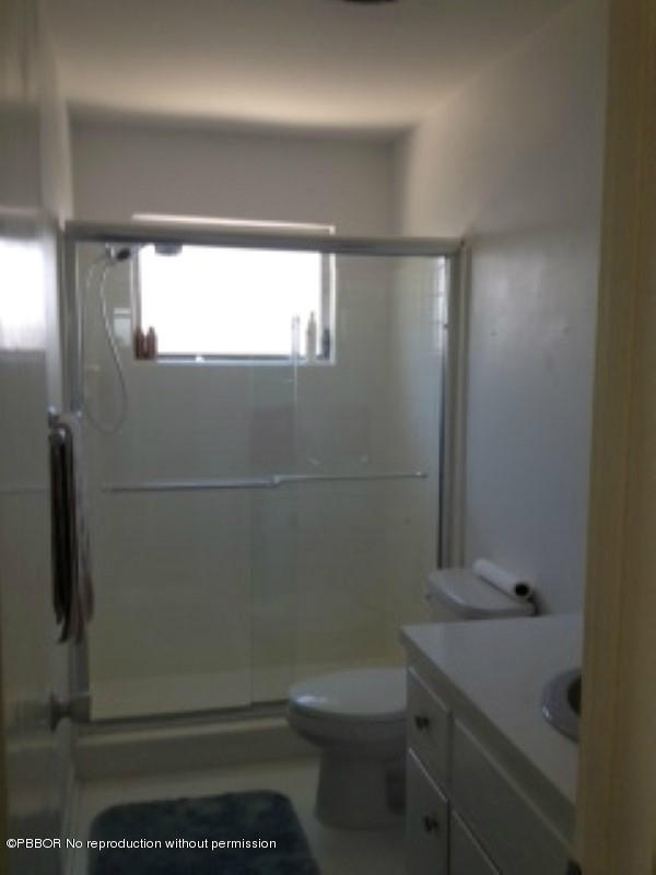 249 Alpine Road West Palm Beach, FL 33405 - Photo 11 of 16 a bathroom with a sink and toilet