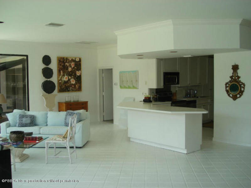 249 Alpine Road West Palm Beach, FL 33405 - Photo 13 of 16 a living room with furniture and a flat screen tv