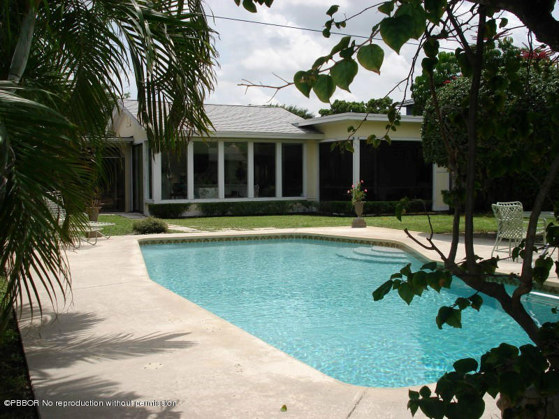 249 Alpine Road West Palm Beach, FL 33405 - Photo 16 of 16 a view of a swimming pool with a patio