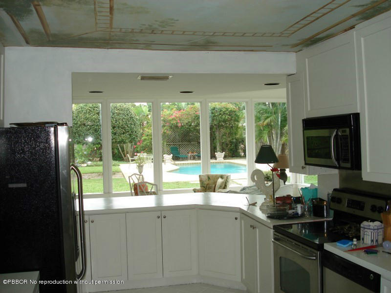 249 Alpine Road West Palm Beach, FL 33405 - Photo 6 of 16 a kitchen with a sink and large window