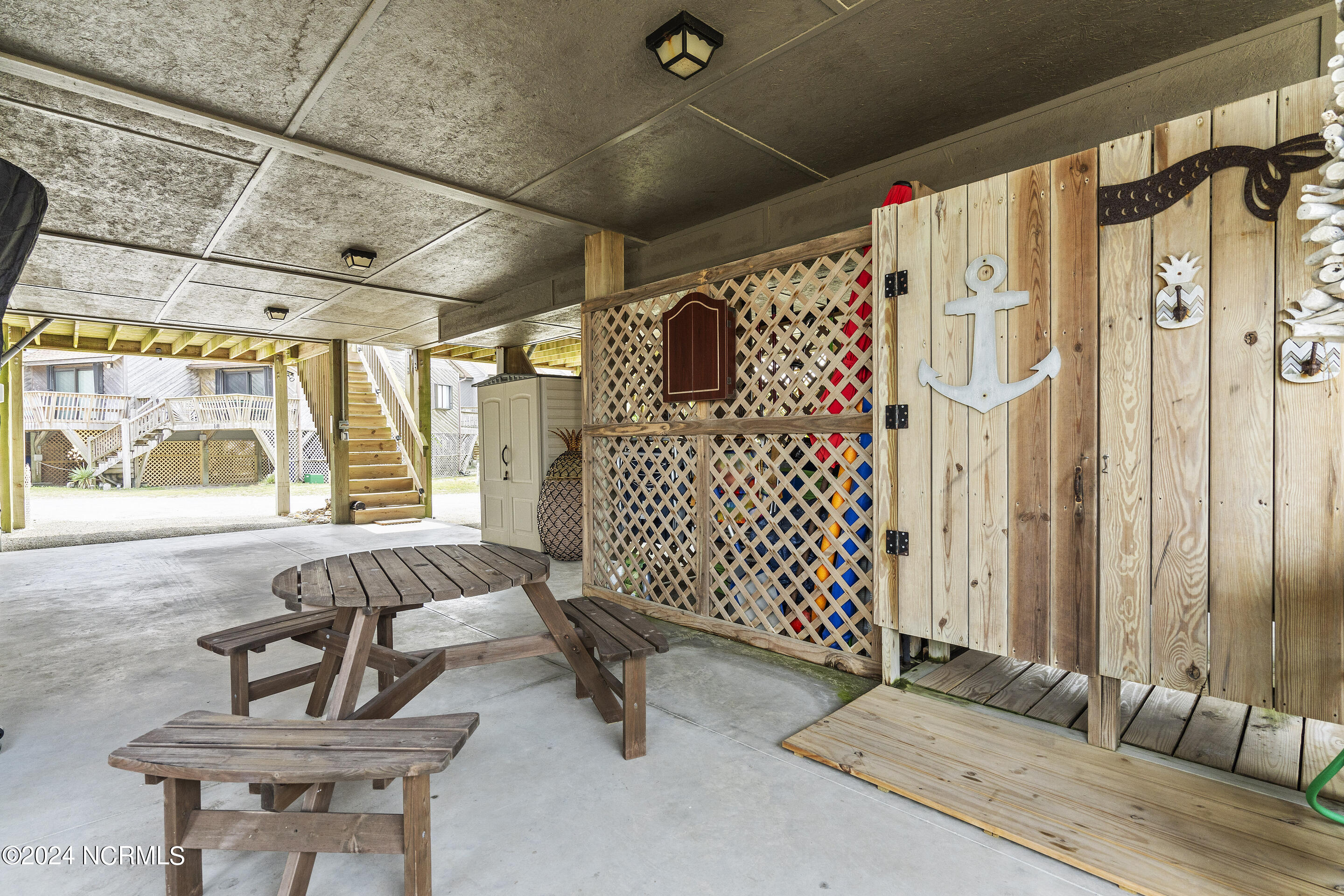 892 New River Inlet Road, Unit 9 North Topsail Beach, NC 28460 - Photo 53 of 74 Picnic Area and Outdoor Shower