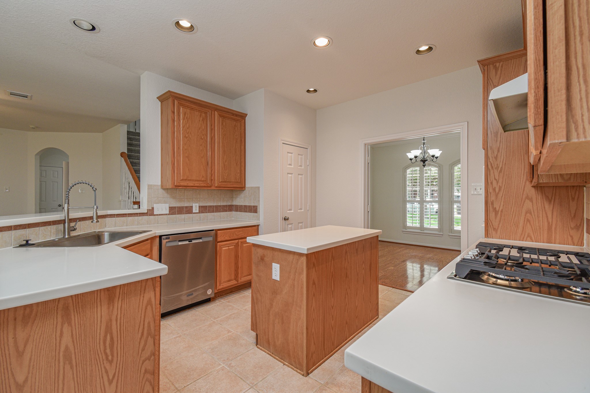 14603 Kings Head Drive Houston, TX 77044 - Photo 13 of 33 a kitchen with stainless steel appliances granite countertop a sink stove and refrigerator