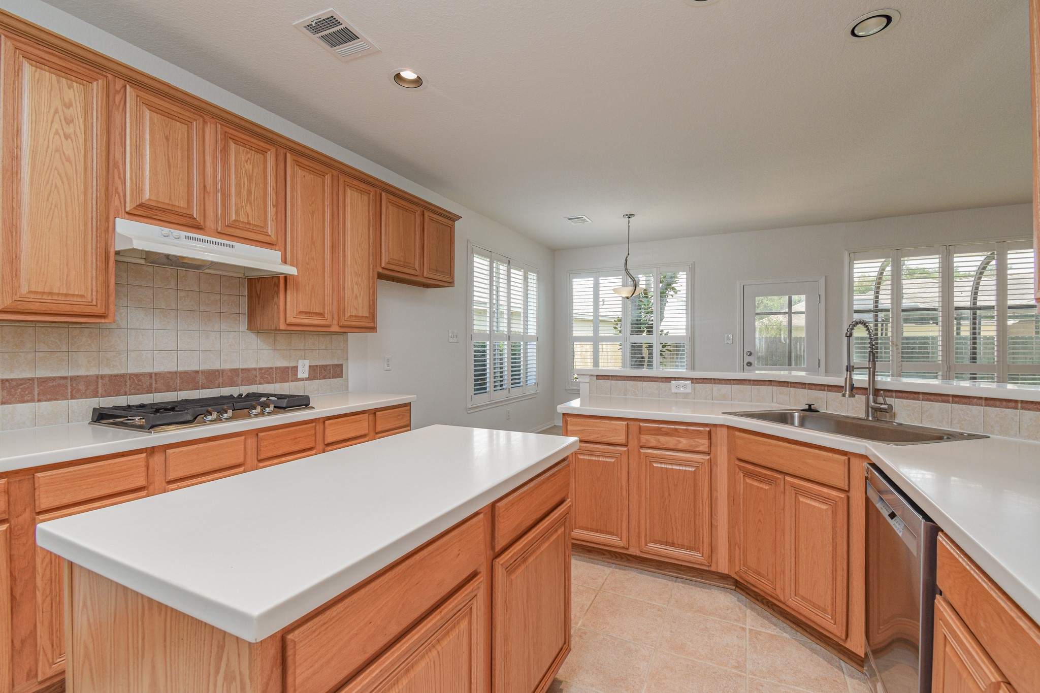 14603 Kings Head Drive Houston, TX 77044 - Photo 15 of 33 a kitchen with stainless steel appliances granite countertop a sink stove and cabinets