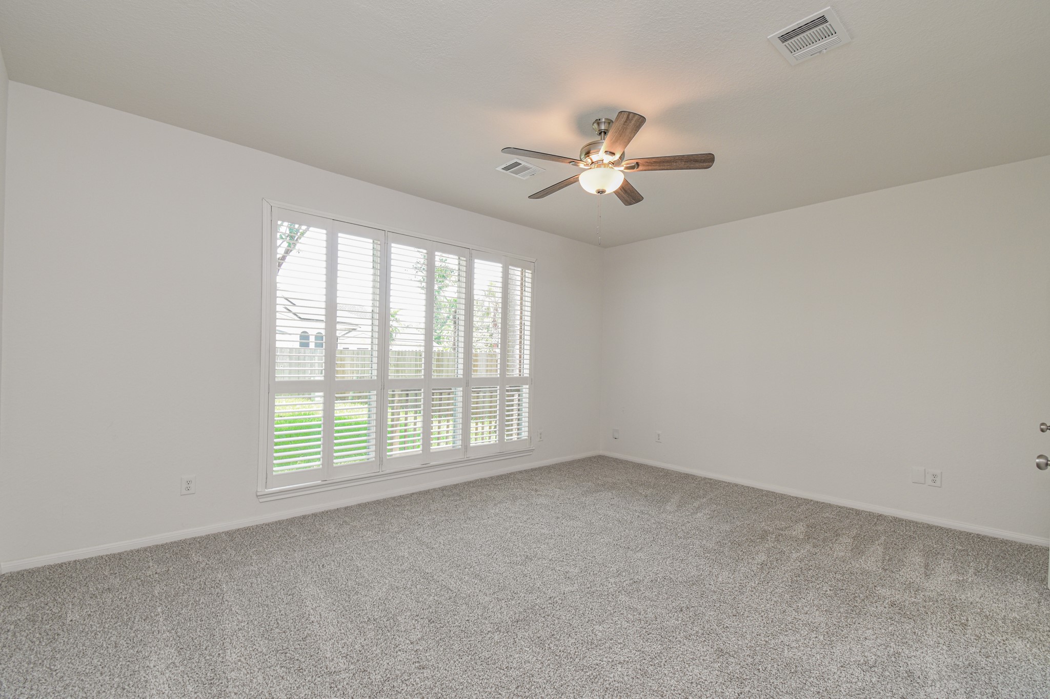 14603 Kings Head Drive Houston, TX 77044 - Photo 18 of 33 a view of an empty room with a window