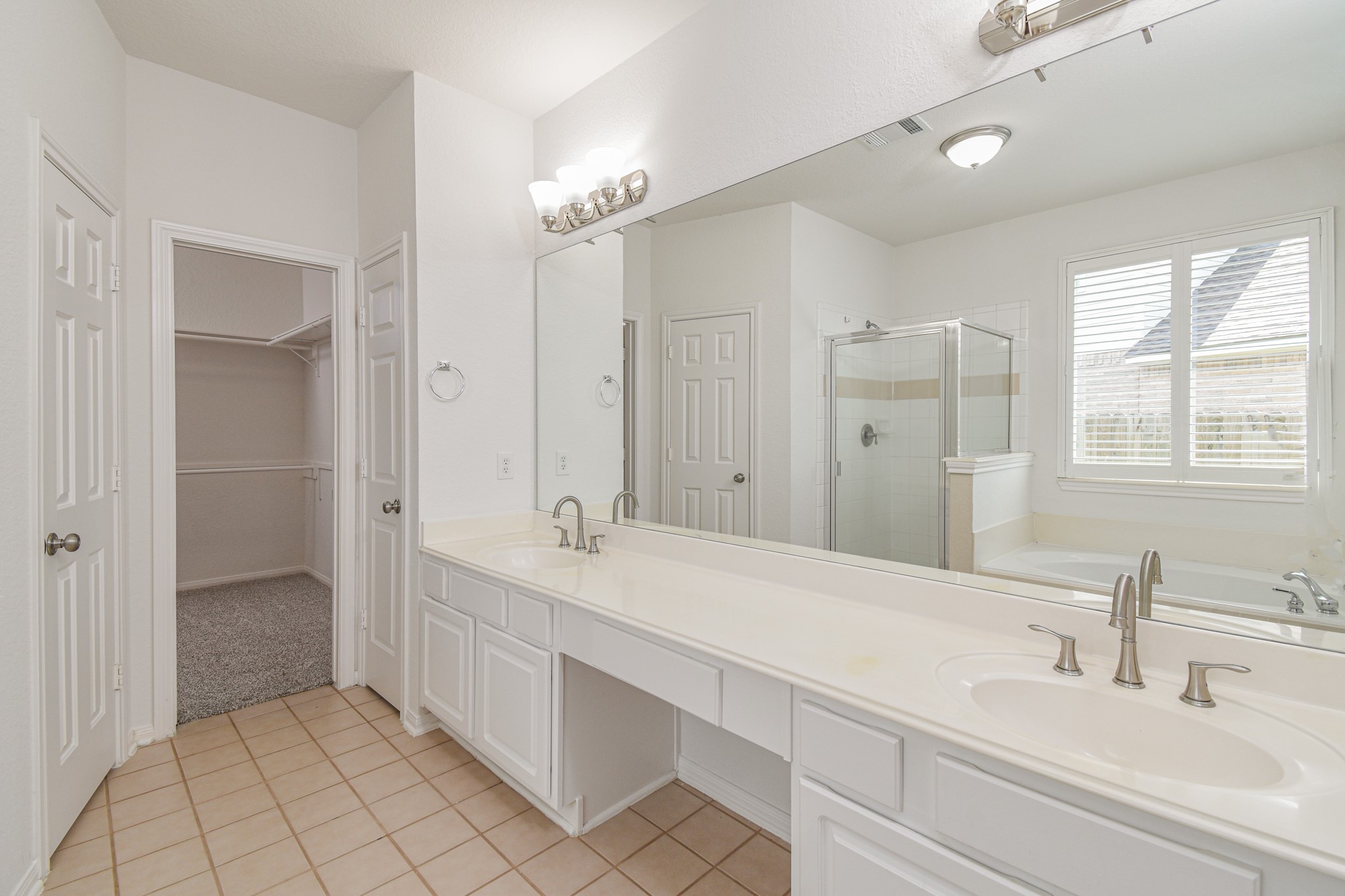 14603 Kings Head Drive Houston, TX 77044 - Photo 20 of 33 a bathroom with a double vanity sink mirror and