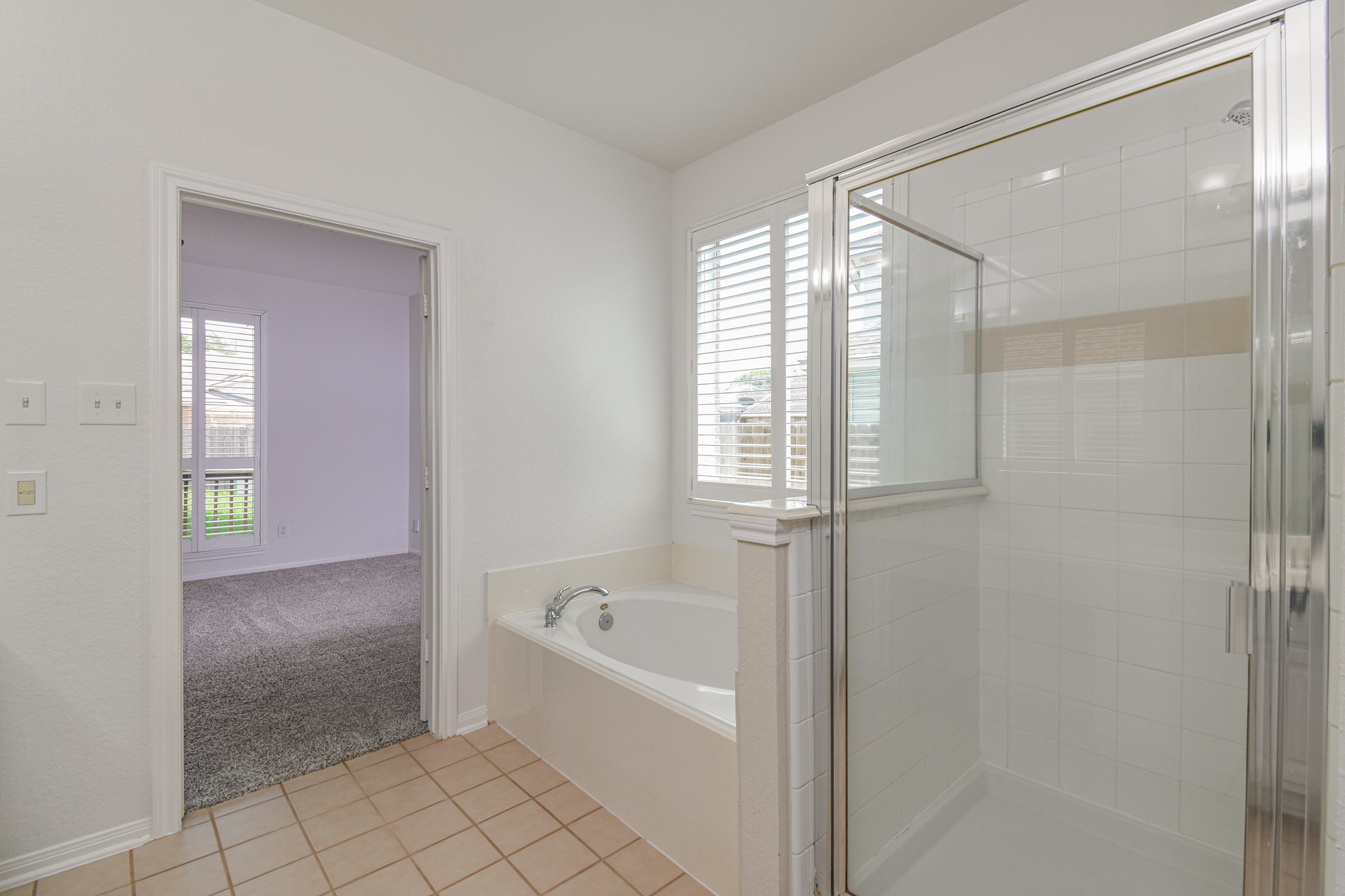 14603 Kings Head Drive Houston, TX 77044 - Photo 21 of 33 a bathroom with a bathtub and shower
