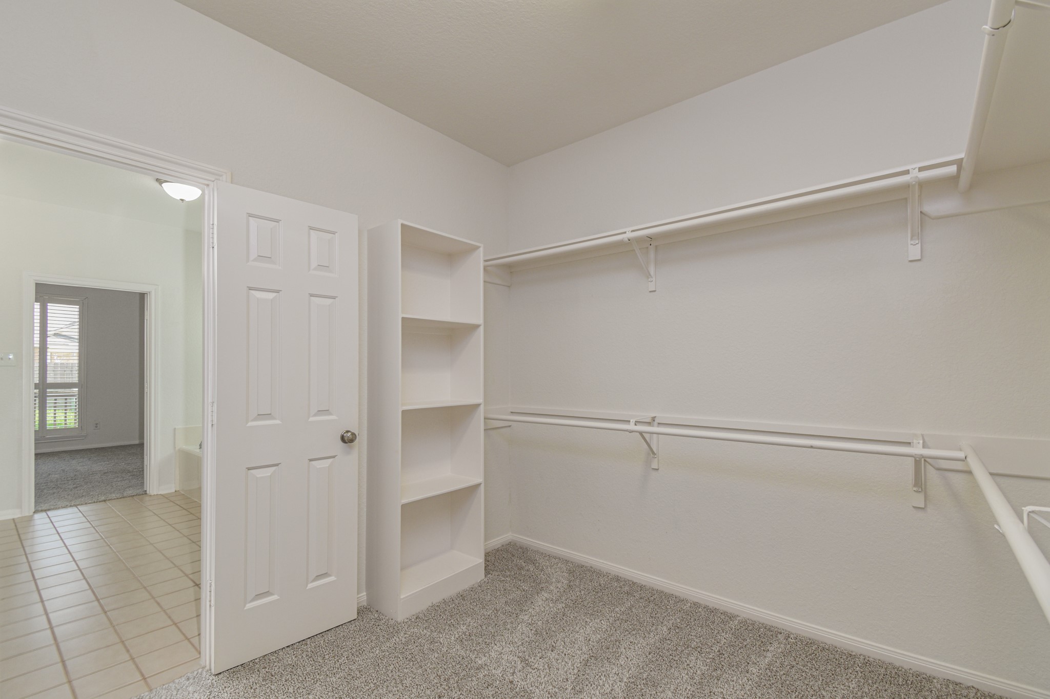 14603 Kings Head Drive Houston, TX 77044 - Photo 22 of 33 a view of an empty walk in closet