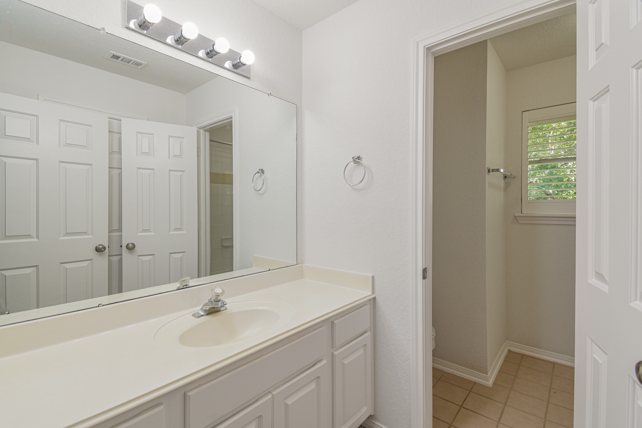 14603 Kings Head Drive Houston, TX 77044 - Photo 29 of 33 a bathroom with a sink and a mirror