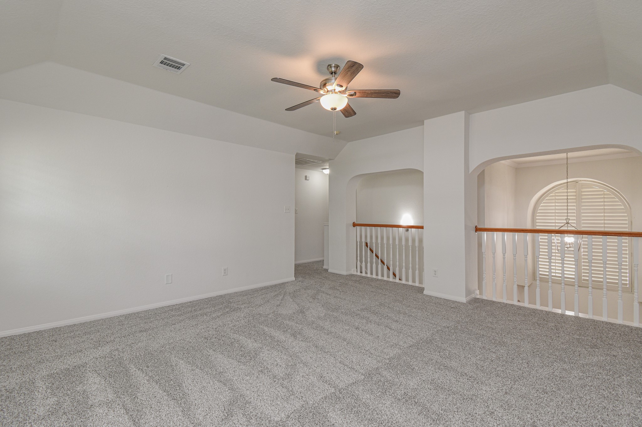 14603 Kings Head Drive Houston, TX 77044 - Photo 31 of 33 a view of an empty room and chandelier fan