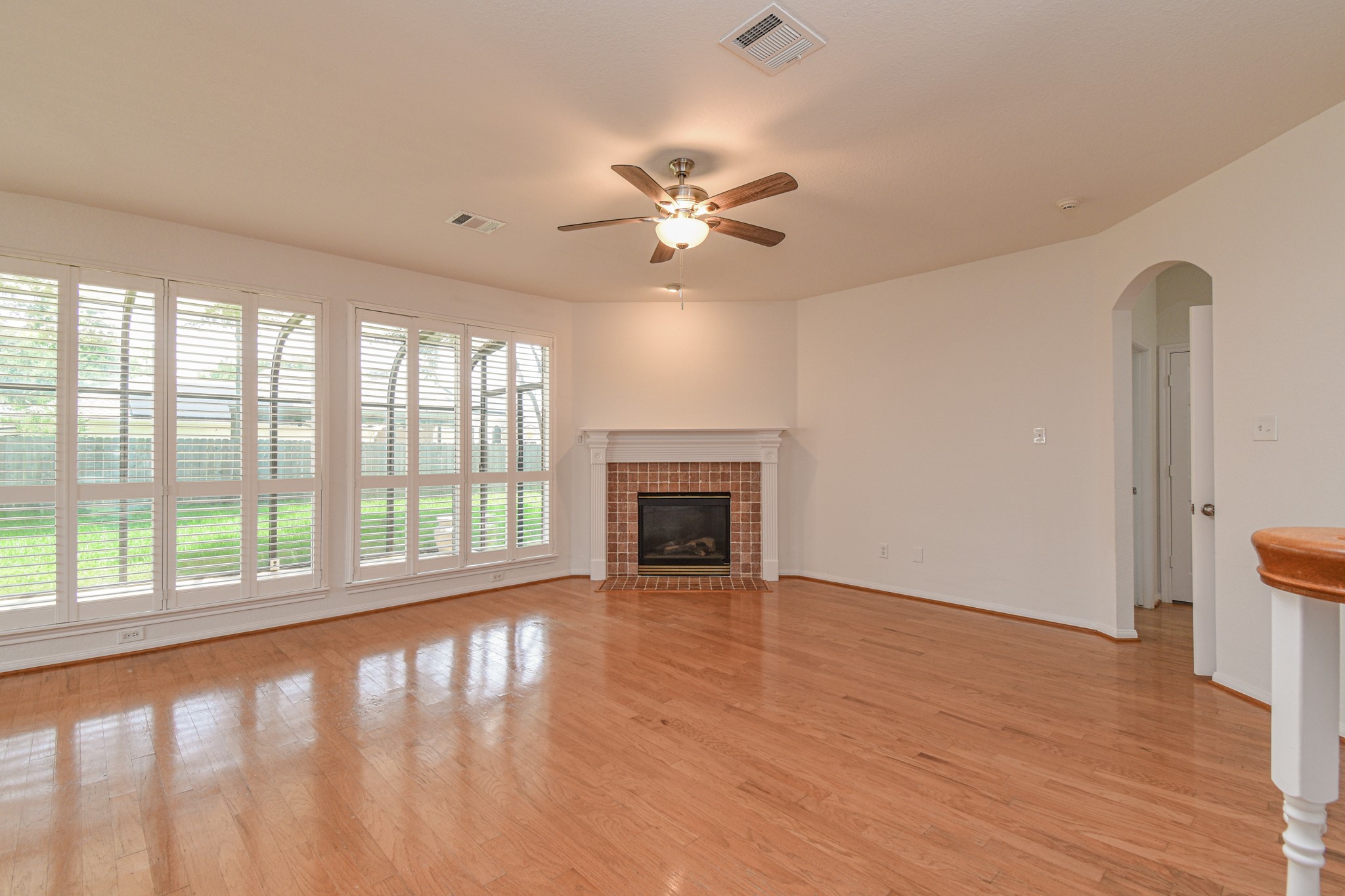 14603 Kings Head Drive Houston, TX 77044 - Photo 10 of 33 a view of an empty room with a window and wooden floor