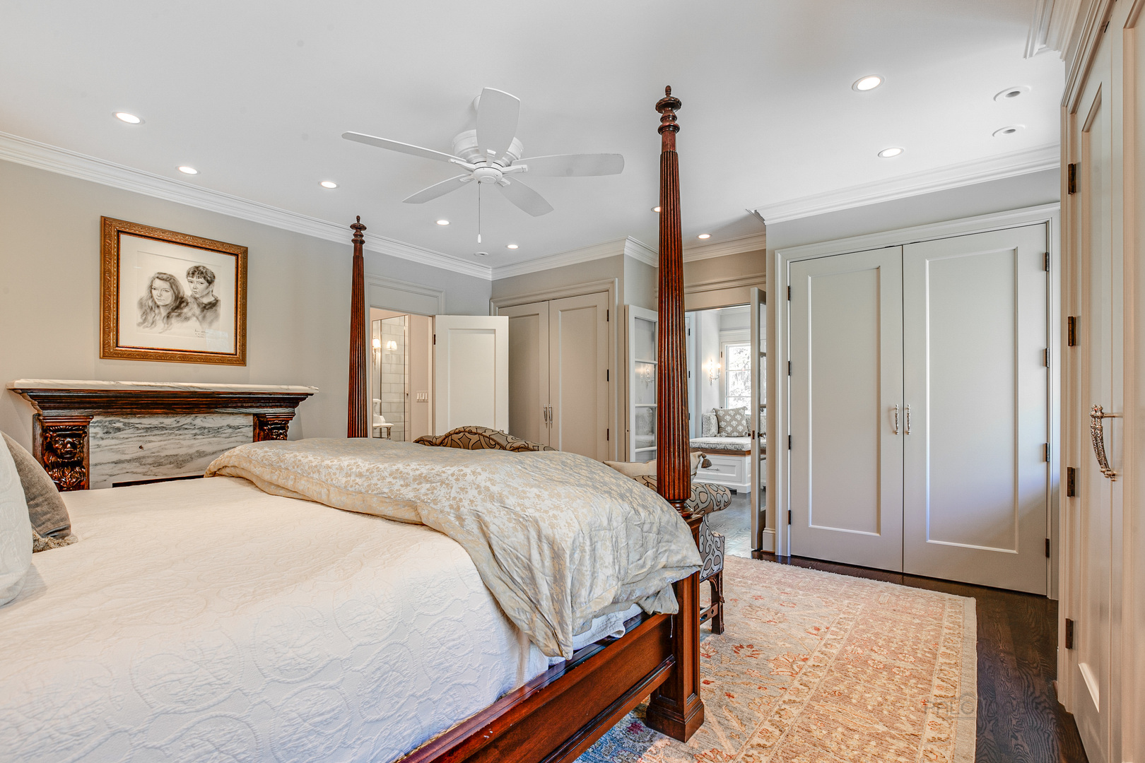 1220 Elm Tree Road Lake Forest, IL 60045 - Photo 24 of 55 a spacious bedroom with a large bed and a chandelier