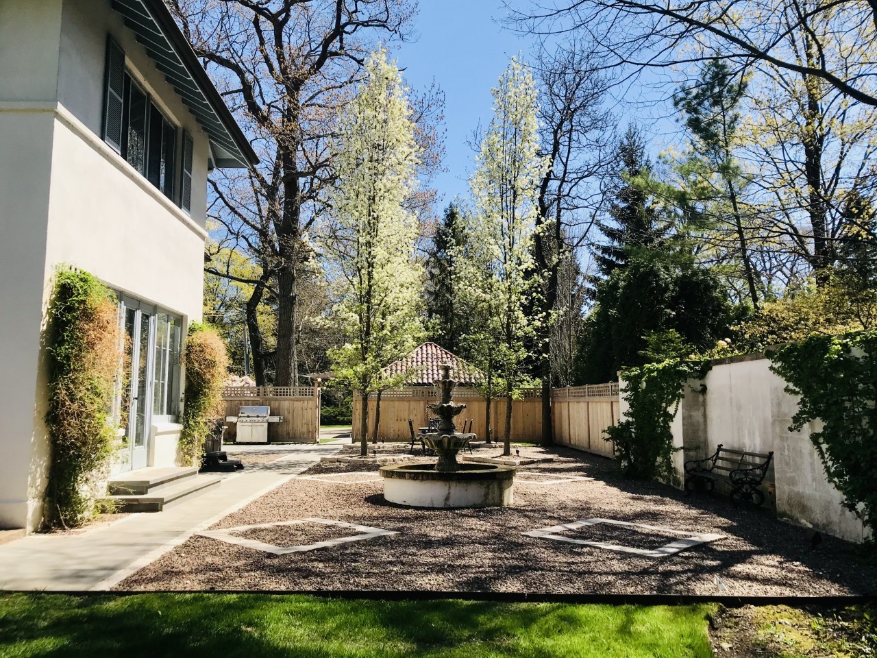 1220 Elm Tree Road Lake Forest, IL 60045 - Photo 41 of 55 a view of a fountain in the yard of the house