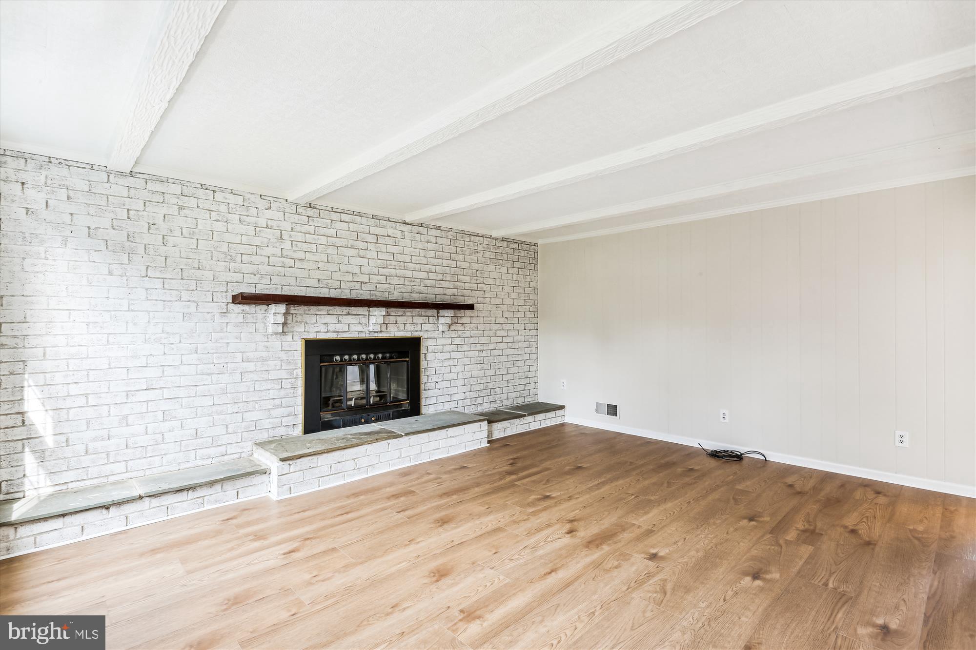 14413 Ansted Road Silver Spring, MD 20905 - Photo 8 of 60 Family room with wood-burning fireplace