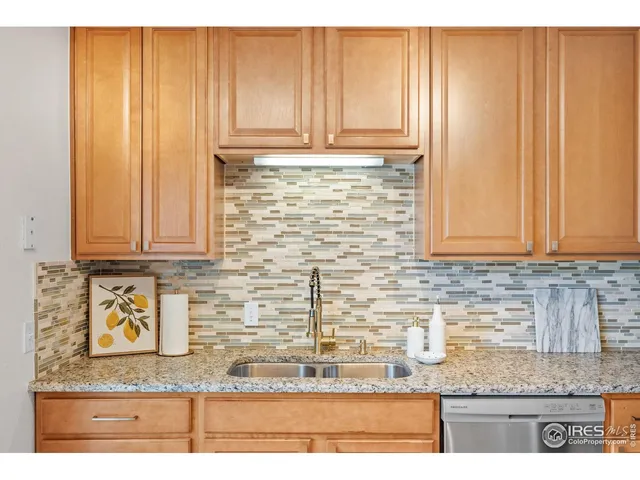 a kitchen with granite countertop cabinets and a counter top space