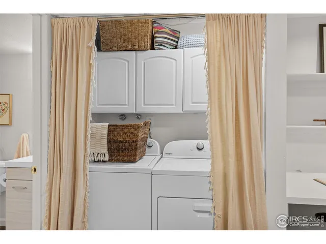 an aerial view of ocean and residential houses with outdoor space and river