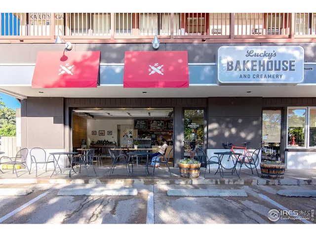 a view of a cafe with sitting area