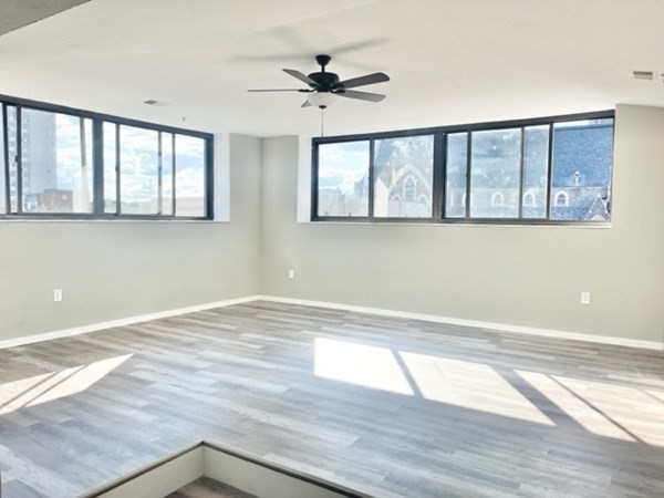 531 Main Street, Unit 505 Worcester, MA 01608 - Photo 1 of 25 a view of an empty room with wooden floor and a window