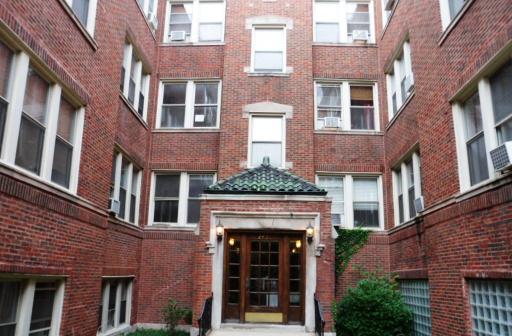 2450 West Addison Street, Unit 2B Chicago, IL 60618 - Photo 2 of 10 a front view of a brick building with windows