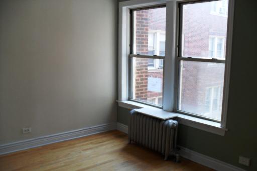 2450 West Addison Street, Unit 2B Chicago, IL 60618 - Photo 4 of 10 a view of an empty room with a window