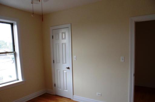2450 West Addison Street, Unit 2B Chicago, IL 60618 - Photo 8 of 10 a view of an empty room with a window