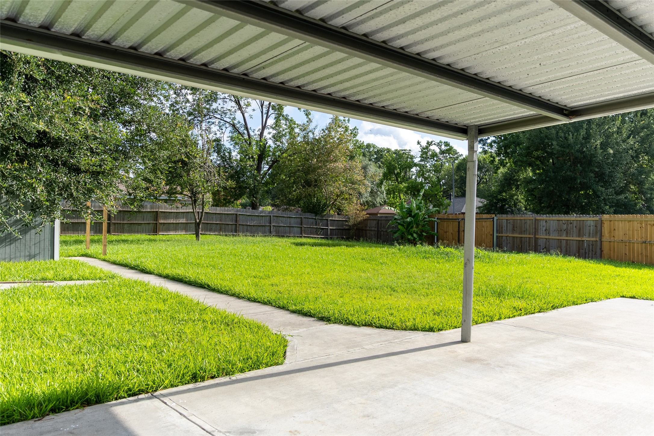 6323 Bridgegate Drive Spring, TX 77373 - Photo 18 of 23 Covered patio section out back an view to side gate entrance