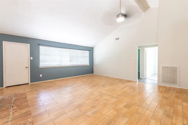 a view of an empty room with a window