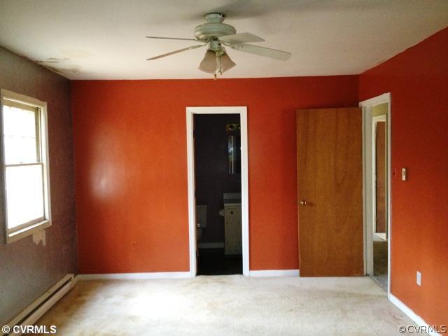 12517 Nash Road Chesterfield, VA 23838 - Photo 9 of 14 an empty room with windows and fan
